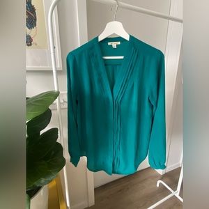 Francesca’s green blouse